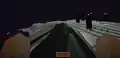 Ein Spieler, der auf dem Enderdrache reitet.