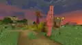 Ein Eisengolem schlägt auf einen angreifenden Zombie ein.