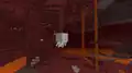 Ein Ghast schwebt ziellos durch den Nether