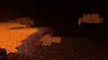 Der Nether wird durch das Leuchten einiger Magmablöcke aufgehellt.