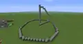 Sichtbarkeitsradius von Partikeln, dargestellt durch Steinziegel - Als Partikelquelle dient die Redstone-Fackel im Zentrum des Aufbaus.