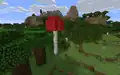 Ein besonders hoher roter Riesenpilz im dichten Wald.