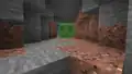 Ein einzelner Schleim begegnet dem Spieler in einer Höhle