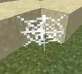 In der Welt platziertes Spinnennetz mit angezeigter Hitbox