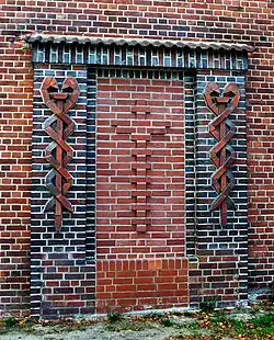 Äskulapstab und Kreuz