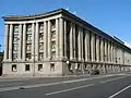 Akademie der Leichtindustrie (1934–1936 mit Leonid Poljakow, Alexander Welikanow, heute St. Petersburger Schiedsgericht), Suworowski Prospekt 50, St. Petersburg[3]