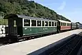 Ehemalige Schweizer Reisezugwagen, vorn B&nbsp;61 (Bj.&nbsp;1910) der Appenzeller Bahn, dahinter C&nbsp;42 (vormals MOB)