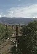 Kreuzung beider Spurweiten in der nördlichen Bahnhofseinfahrt, vor Unterbrechung des Normalspurgleises