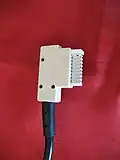 Ein „ADoS 16“ (TAE 16)-Stecker