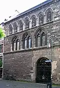 Grashaus Aachen, Figurenfries nach Plänen von Cremer