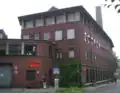 Schornstein und Reste der Nellessenschen Tuchmanufaktur. Heute Probebühne des Aachener Stadttheaters.
