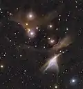 Infrarotaufnahme mithilfe Teleskops VISTA des südlichen Bereihs von Cha I, umfaasend HD 97048, DI Chamaeleontis (beide oben links) und Cha IRN (heller Nebel unten rechts)