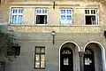Historische deutschsprachige Aufschrift am ehemaligen Bahnhof Auer/Ora