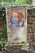 Grabstein von Johann Aloisius Delges, „Pfarrer in Auw 30.4.1881 - 5.4.1908 - 31.5.1947“