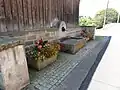 Einer der Dorfbrunnen