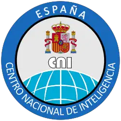Ein blaues Logo mit den Emblemen Spaniens in der Mitte