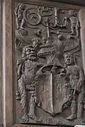 Holztäfelung mit Wildem Mann und Wilder Frau als Schildhalter