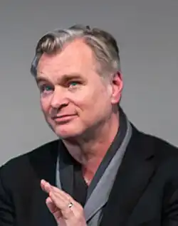 Picture of director Christopher Nolan clapping at an „In Conversation“ panel at the British Film Institute Southbank theatre in February 2024