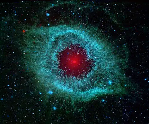 IR-Aufnahme: blau 3,6...4,5&nbsp;µm, grün 5,8...8&nbsp;µm, rot 24&nbsp;µm (Spitzer Space Telescope)