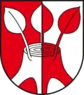 Von Rot und Silber gespalten mit einem von drei jungen Trieben beblätterten Baumstumpf in verwechselten Farben (Dönitz/Altmark, DE)
