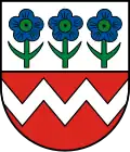 Leinstetten In geteiltem Schild oben in Silber (Weiß) drei grün bestielte und grün besamte Blüten der Leinpflanze nebeneinander, unten in Rot ein silberner (weißer) Zickzackbalken