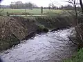 Unscheinbare Mündung in den Grenzgraben