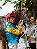 Erle mit Jockey Martin Seidl im Absattelring