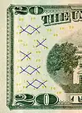 Vorderseite (Ausschnitt) der 20-Dollar-Banknote mit markierten Omron-Ringen (als Teil der Wertzahl 20)