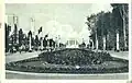 Boulevard du Centenaire, an dessen Ende der Grand Palais sichtbar ist.