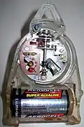 Wanduhrwerk (Rückseite); elektrodynamischer Unruh-Antrieb (Sperrschwinger)