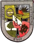 Burschenschaft Franconia Freiburg: Schwarzes Kreuz, Händedruck mit Ouroboros, aufgehende Sonne, Eiche, Leier und Schwert, Zirkel auf Farbband, Wahlspruch.