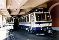 Die beiden GN Bhe 4/8 304 und 302 mit Vorstellwagen im Bahnhof Montreux