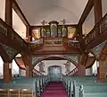 Innenansicht der Kirche mit Blick auf Orgel und Ausgang