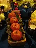 Hadschi Firuz als Dekoration des Haft-Sin-Tisches