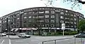 Wohnblock mit Läden Maria-Louisen-Str. 63–67, die sogenannten Burmeisterhäuser