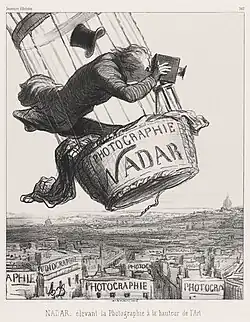 Karikatur von Honoré Daumier: Nadar, die Photographie auf die Höhe der Kunst erhebend, franz.: NADAR élevant la Photographie à la Hauteur de l’Art, 1862