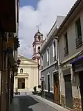 Blick aus der Straße Carrer Major auf die Himmelfahrts-Kirche
