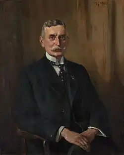 Porträt von Koningsberger, 1925. Ein magerer älterer Mann mit einem Schnurrbart.