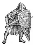 Germanischer (karolingischer) Fußkämpfer mit geschupptem Überwurf (Kutte), der Hals und Oberarme bedeckt.