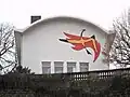 "Phönix aus der Asche", ca. 1955, Sgraffito am VHS-Gebäude am Saarbrücker Schlossplatz[6]