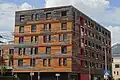 Das 2016 anstelle des Hallenbades errichtete Studentenwohnhaus „mine room“, ein Passivhaus in Holzbauweise[5]