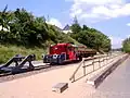 Köf II mit Flachgüterwagen als Denkmal in Pronsfeld
