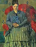 Paul Cezanne: Mme Cézanne in rotem Lehnstuhl, 1877
