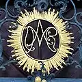 Marienmonogramm am Portal der Talkirche Münnerstadt
