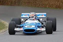 Jackie Stewart fährt seinen Matra MS80 während einer Vorführung beim Goodwood Festival of Speed (2009)
