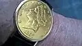 Meisterwerksarbeit, Ebel-Sprungdeckel­armbanduhr (in echt goldener Zwanzig-Dollar-Münze von 1897 der USA)