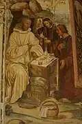 Ein Priester teilt sein Ostermahl mit Benedikt