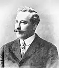 Mr. F.S. Cairns, Direktor der Steuererhebung und Mr. Shusters Hauptassistent, 1911