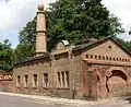 Gärtnerhaus an der Stadtmauer mit stilisiertem Minarett