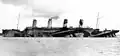 HMT Olympic in Dazzle Camouflage als Truppentrans­por­ter im Ersten Welt­krieg (ab September 1915)